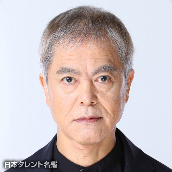 境　賢一